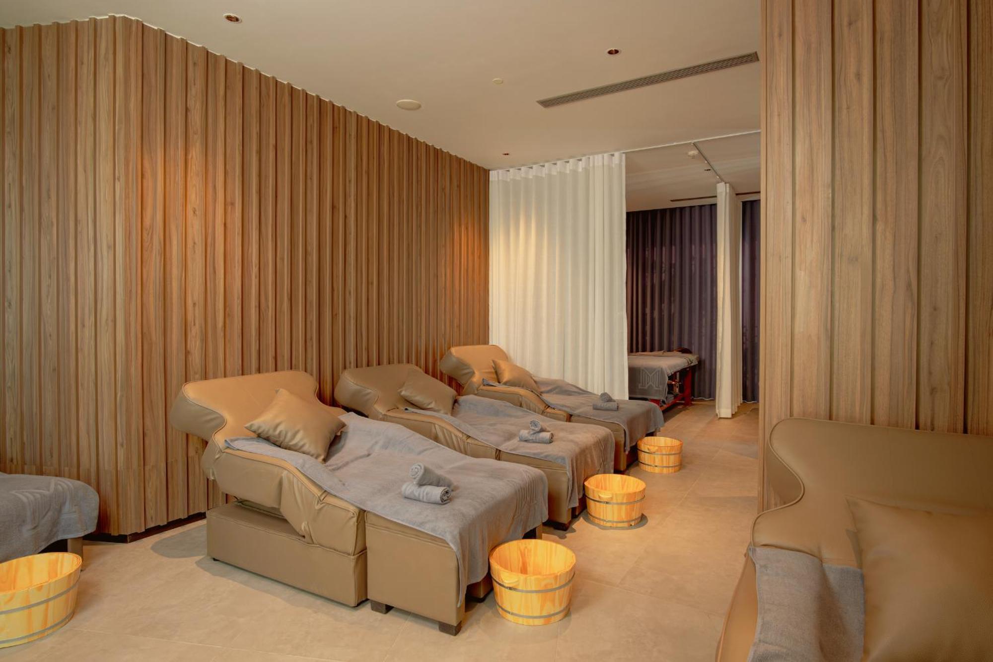 M Hotel Danang Exterior photo A foot reflexology room at a spa
